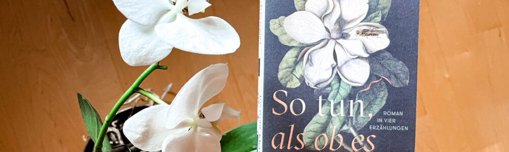 Buchcover neben weisser Orchidee