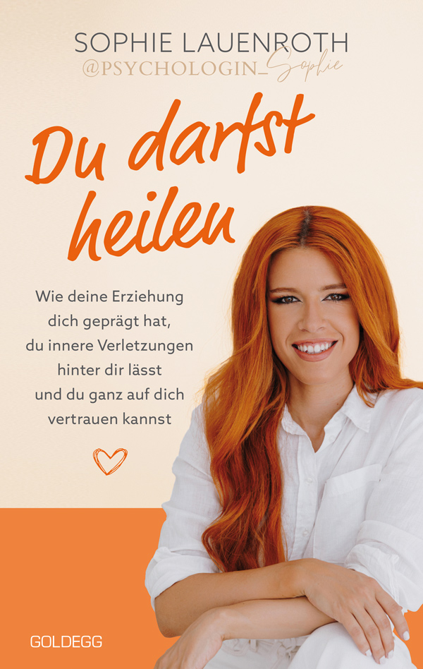 Das Cover von «Du darst heilen» zeigt das Portrait der Autorin vor orangem Hintergrund. Der Titel steht ebenfalls in oranger Schrift quer über die Seite, in der oberen Hälfte. 